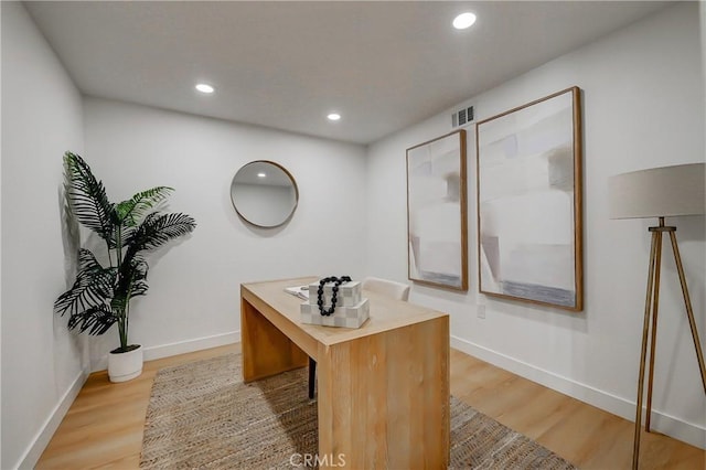 office space featuring light hardwood / wood-style floors