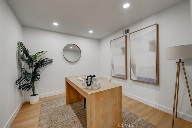 office with baseboards, recessed lighting, visible vents, and light wood-style floors