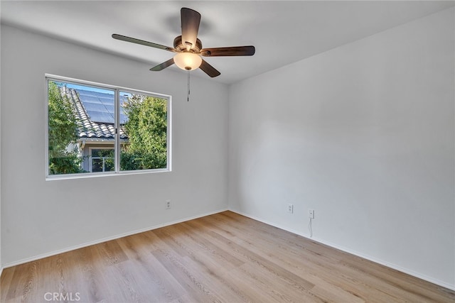 spare room with ceiling fan and light hardwood / wood-style floors