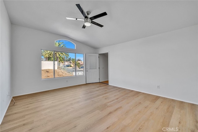 unfurnished bedroom with ceiling fan, lofted ceiling, and light wood-type flooring