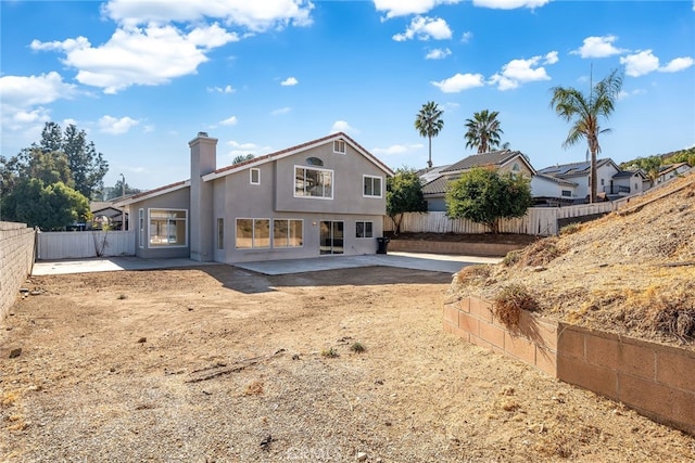 back of property featuring a patio