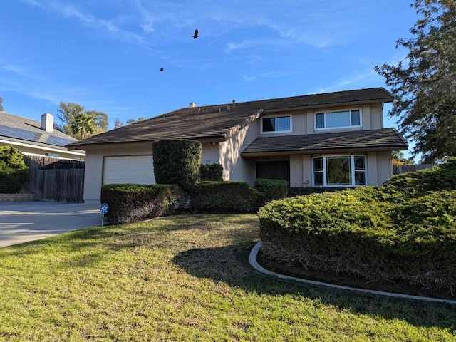 view of front facade featuring a front yard and a garage