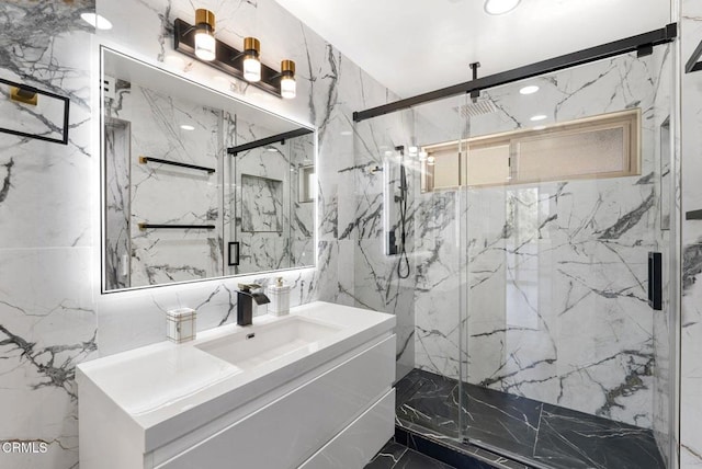 bathroom featuring vanity and a shower with door