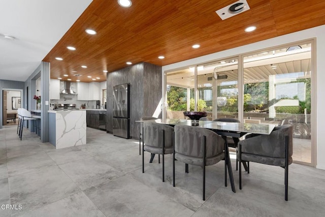 dining room with wood ceiling