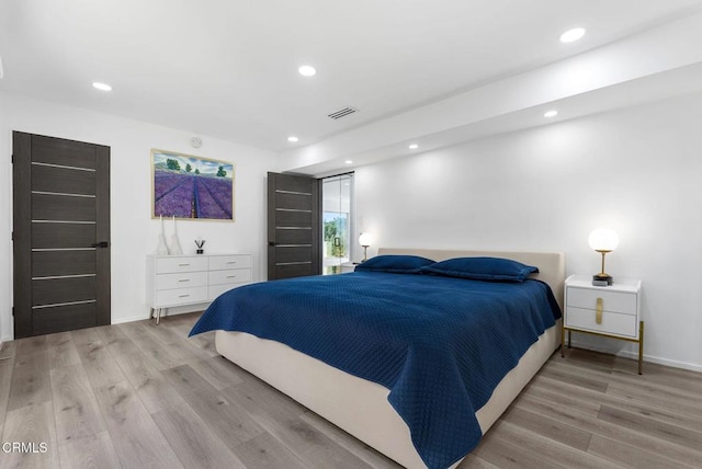 bedroom featuring light wood-type flooring