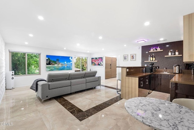 living room with indoor wet bar and a wealth of natural light