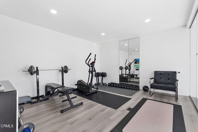 workout area with light wood-type flooring