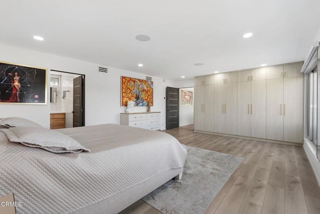 bedroom with light hardwood / wood-style floors