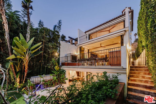 back of house with a balcony