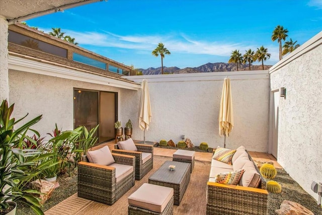 view of patio with a mountain view and an outdoor hangout area