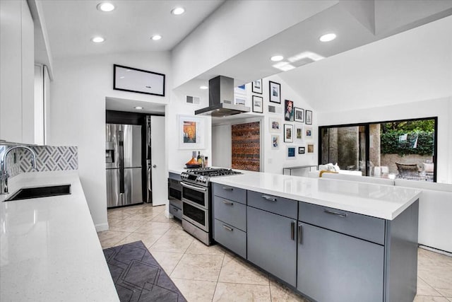 kitchen with island range hood, sink, stainless steel appliances, and vaulted ceiling