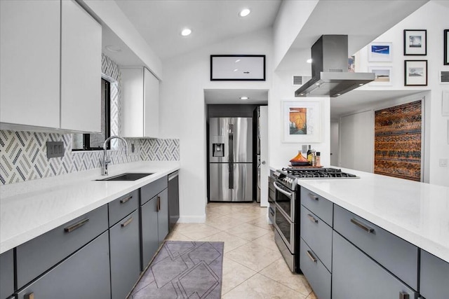 kitchen with lofted ceiling, ventilation hood, sink, gray cabinets, and stainless steel appliances