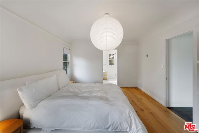 bedroom featuring hardwood / wood-style flooring