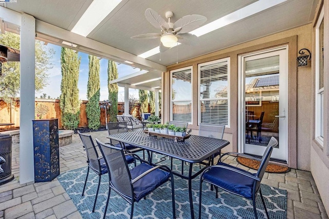 sunroom / solarium with ceiling fan