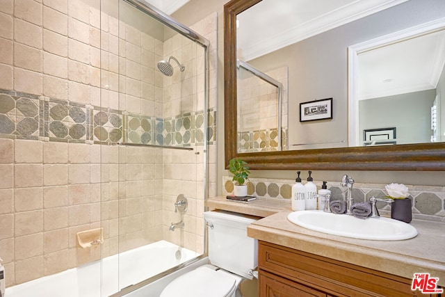 full bathroom featuring shower / bath combination with glass door, vanity, tasteful backsplash, and crown molding