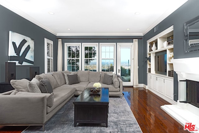 living room with dark hardwood / wood-style flooring and ornamental molding