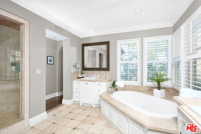 bathroom featuring tile patterned floors, crown molding, vanity, and independent shower and bath