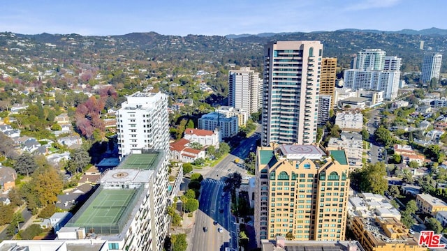 birds eye view of property with a mountain view