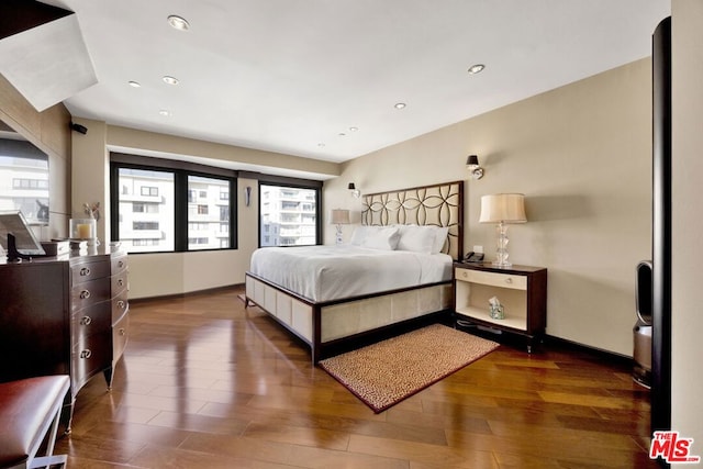 bedroom featuring dark hardwood / wood-style floors