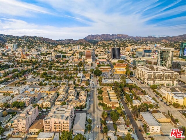 birds eye view of property with a mountain view