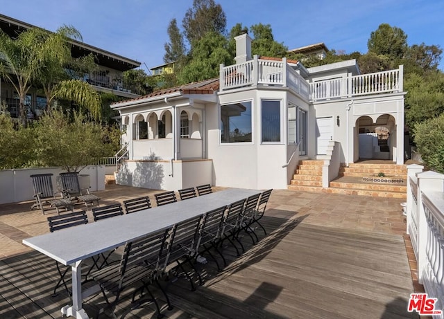 exterior space with a patio area and a bar