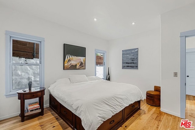 bedroom with light hardwood / wood-style floors