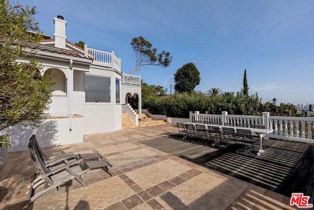 view of patio / terrace with a balcony