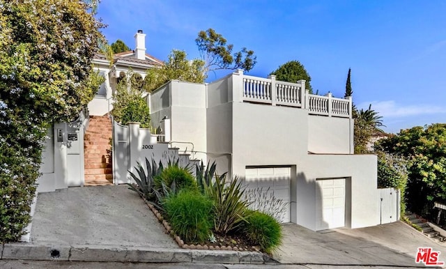 view of front of property with a garage