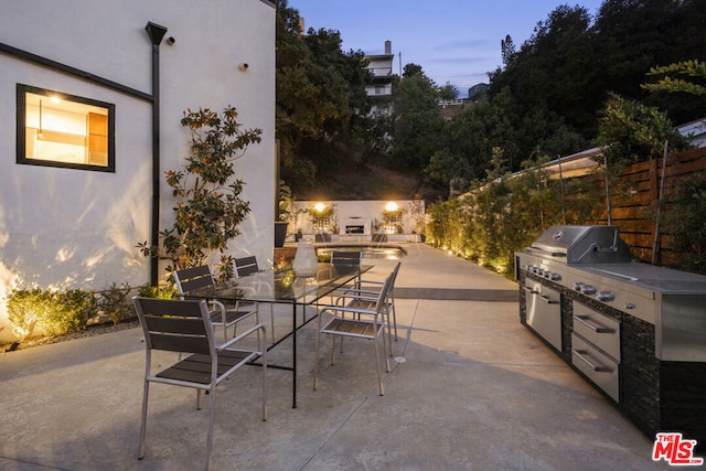 patio terrace at dusk with area for grilling