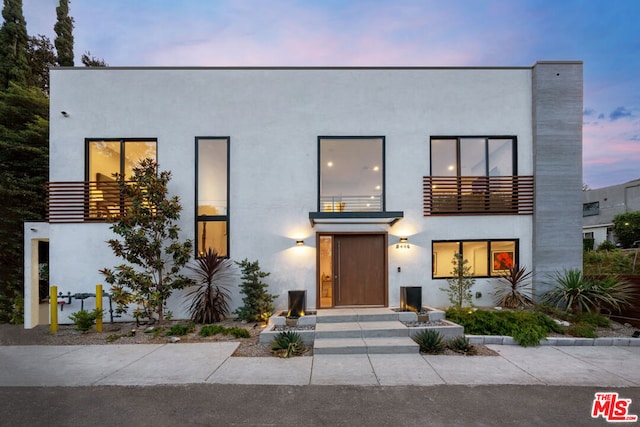 modern home featuring a balcony