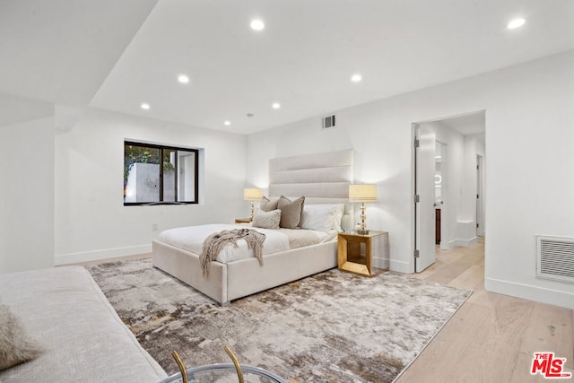 bedroom featuring light wood-type flooring