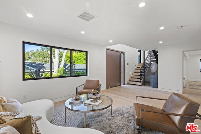 living room with light hardwood / wood-style floors