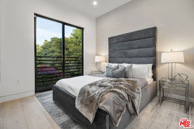 bedroom with light wood-type flooring