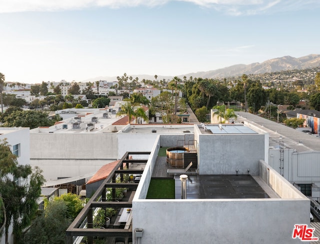 birds eye view of property featuring a mountain view