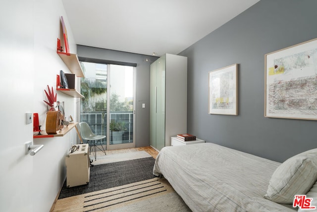 bedroom with hardwood / wood-style floors