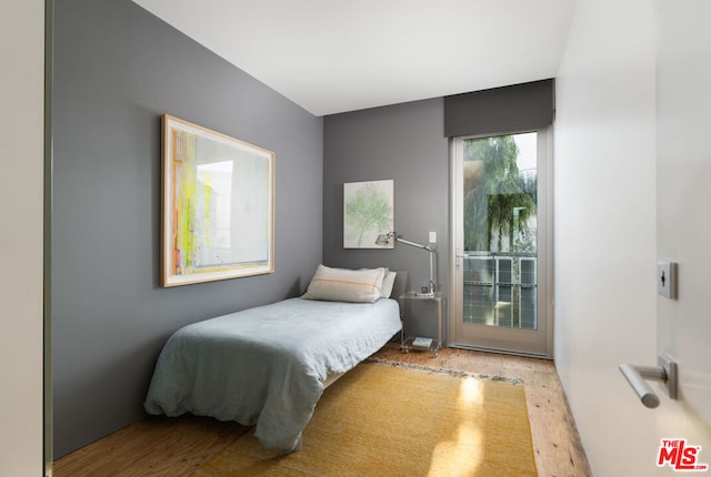 bedroom with light hardwood / wood-style flooring