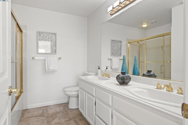 full bathroom with tile patterned flooring, shower / bath combination with glass door, vanity, and toilet