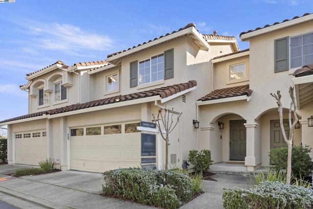 mediterranean / spanish house featuring a garage