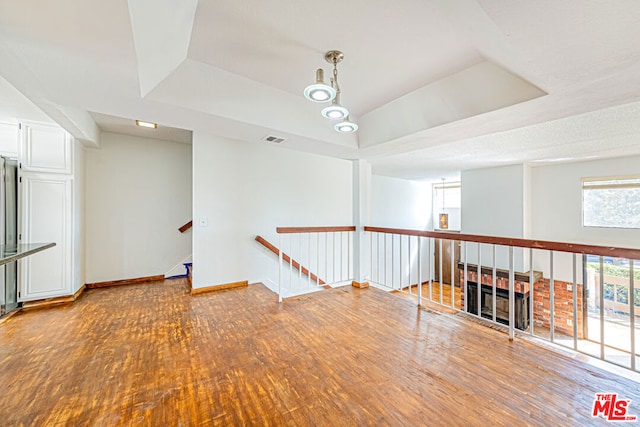 empty room with wood-type flooring