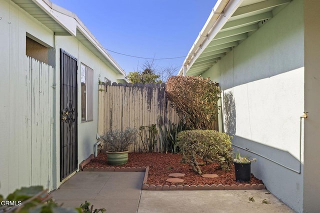 view of side of home featuring a patio