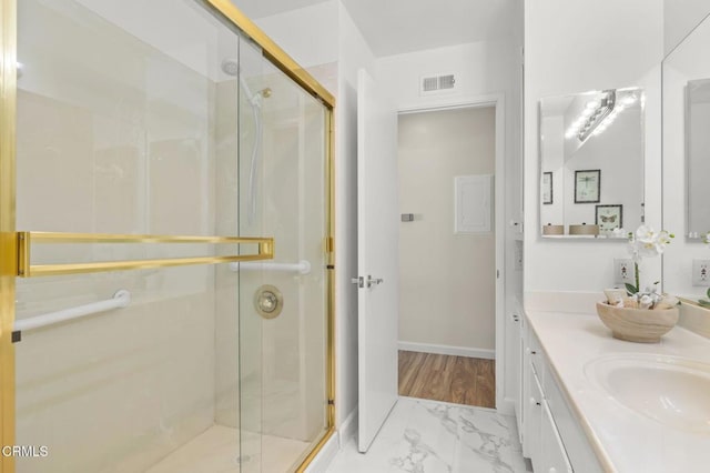 bathroom with vanity and an enclosed shower