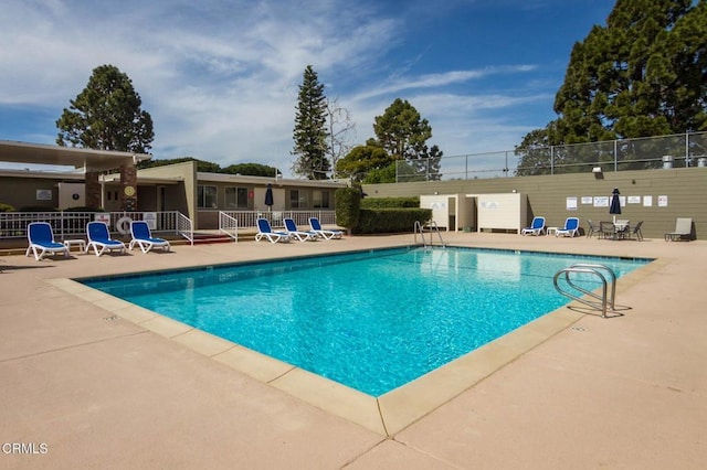 view of pool featuring a patio