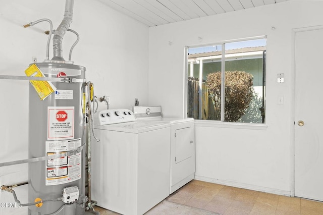 laundry room with secured water heater and separate washer and dryer