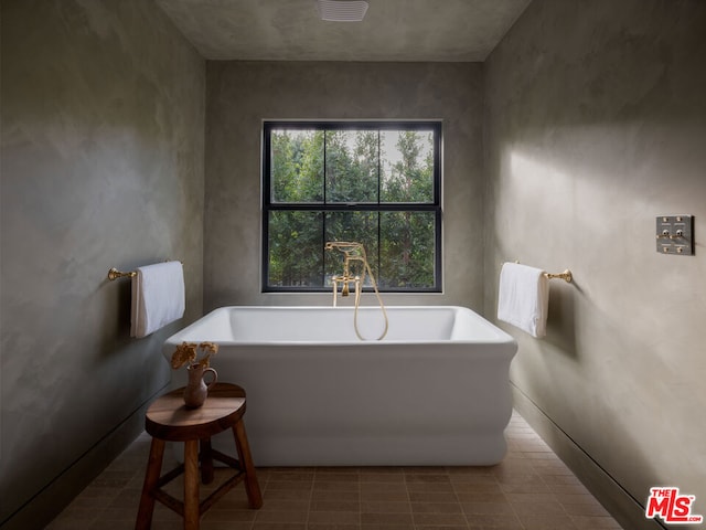 bathroom featuring a tub to relax in