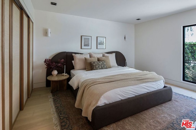 bedroom featuring light hardwood / wood-style floors