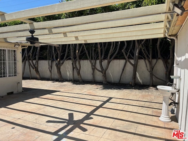 view of patio / terrace featuring a pergola and ceiling fan