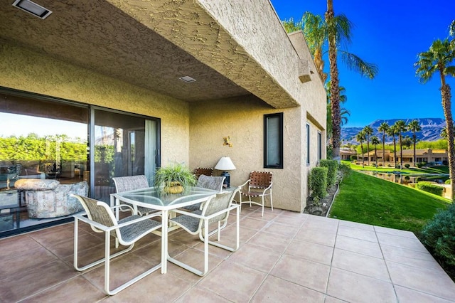 view of patio / terrace with a mountain view