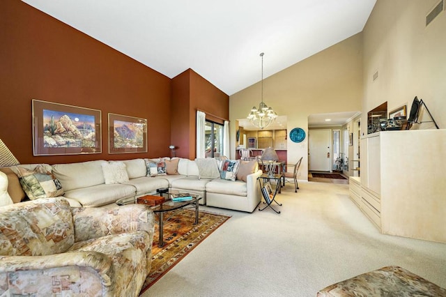 living room featuring a chandelier, carpet floors, and high vaulted ceiling