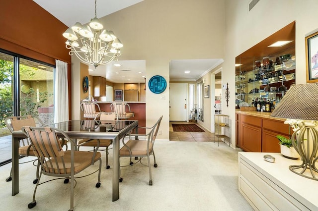 dining space featuring a high ceiling, light colored carpet, and an inviting chandelier