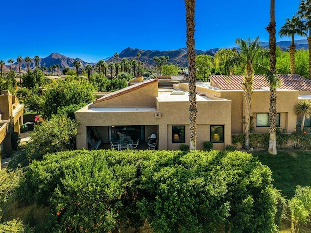 back of house featuring a mountain view